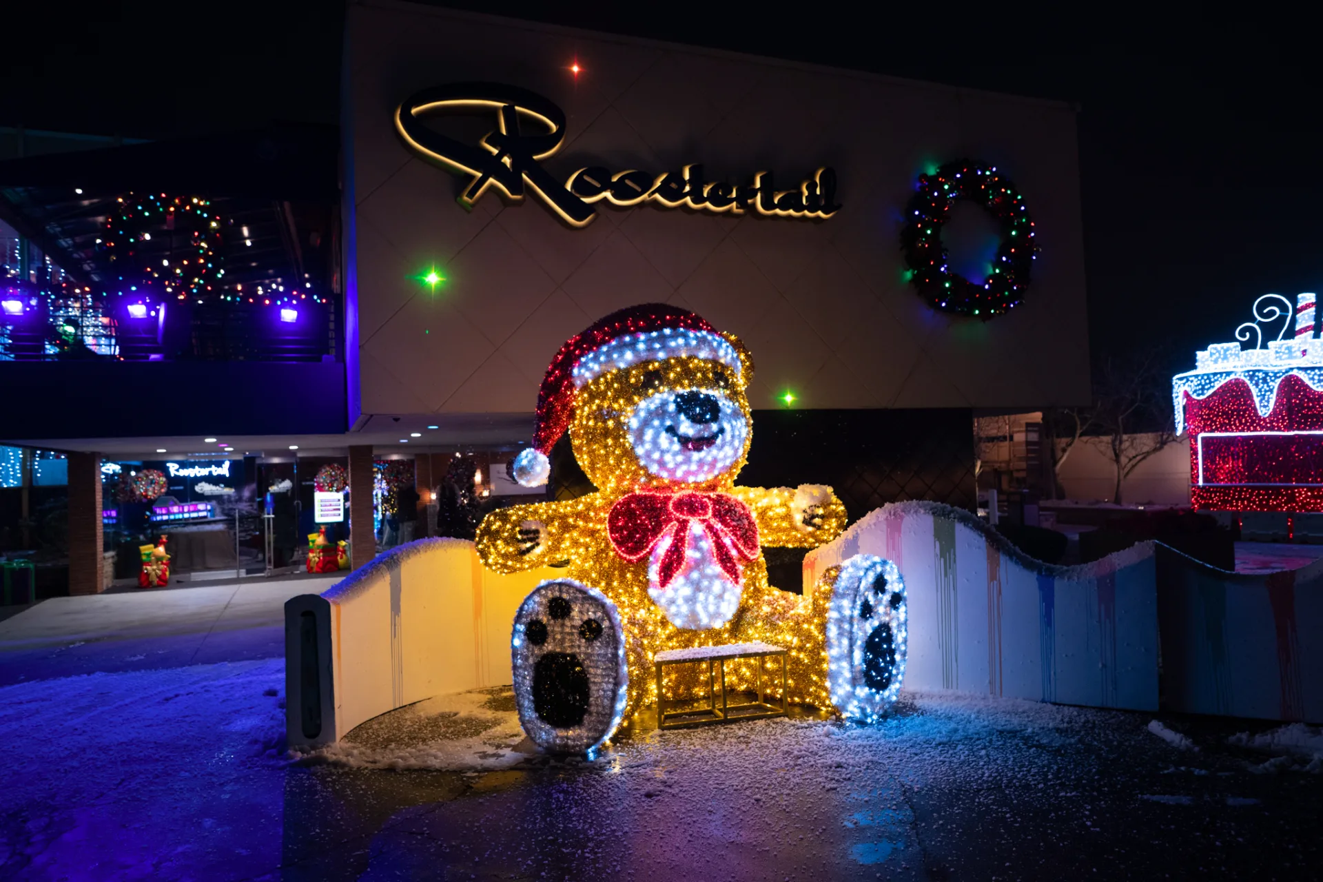 The Roostertail entrance lit for Christmas with the giant glowing teddy bear
